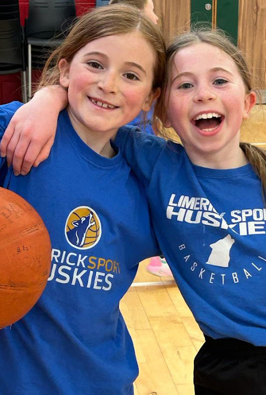 Huskies basketball players smiling